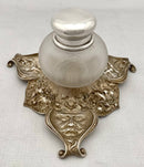 Victorian silver plated inkstand of trefoil form adorned with facial profiles. Elkington 1857 for The Art Manufacturers Association.