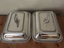 Pair of late Georgian Old Sheffield Plate crested entree dishes with covers and detachable handles.