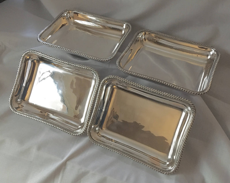 Georgian, George III, set of four Sheffield Plated entree dishes and covers with matching crests. Circa 1810.