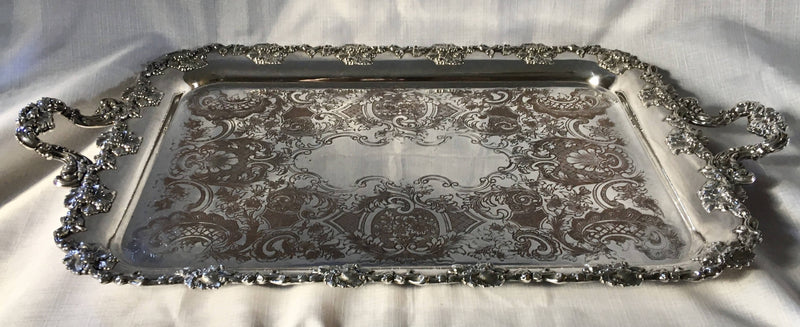 A 19th century ornate Sheffield Plated twin handled serving tray.