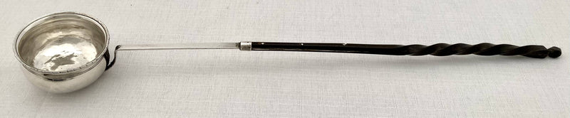 Georgian, George III period, white metal toddy ladle, circa 1810.