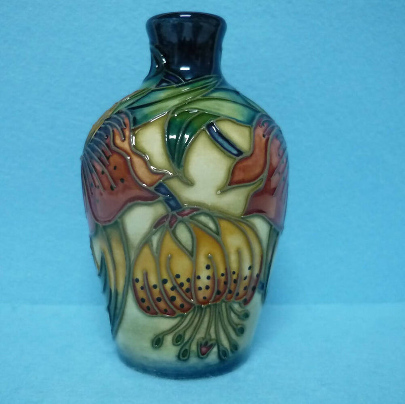 A Boxed Moorcroft Vase in the Anna Lily Design by Nicola Slaney.