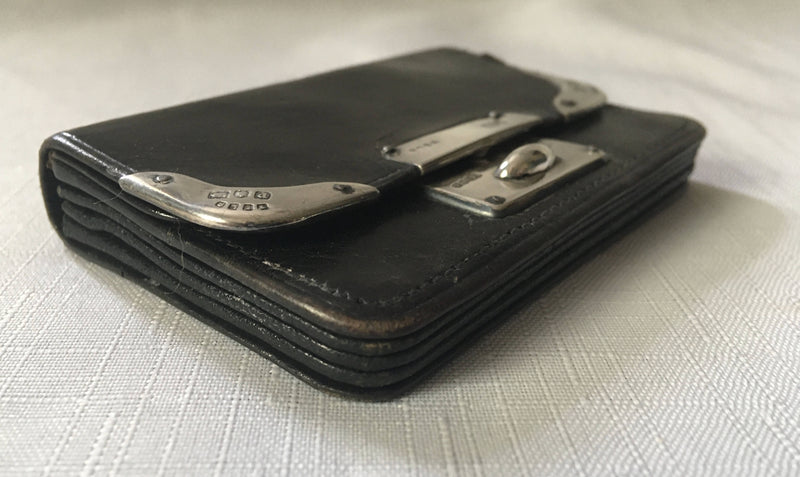 Victorian silver mounted black leather purse. London 1899 Thomas De La Rue & Co.