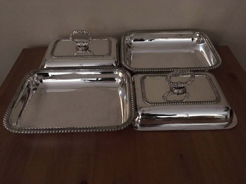 Pair of late Georgian Old Sheffield Plate crested entree dishes with covers and detachable handles.