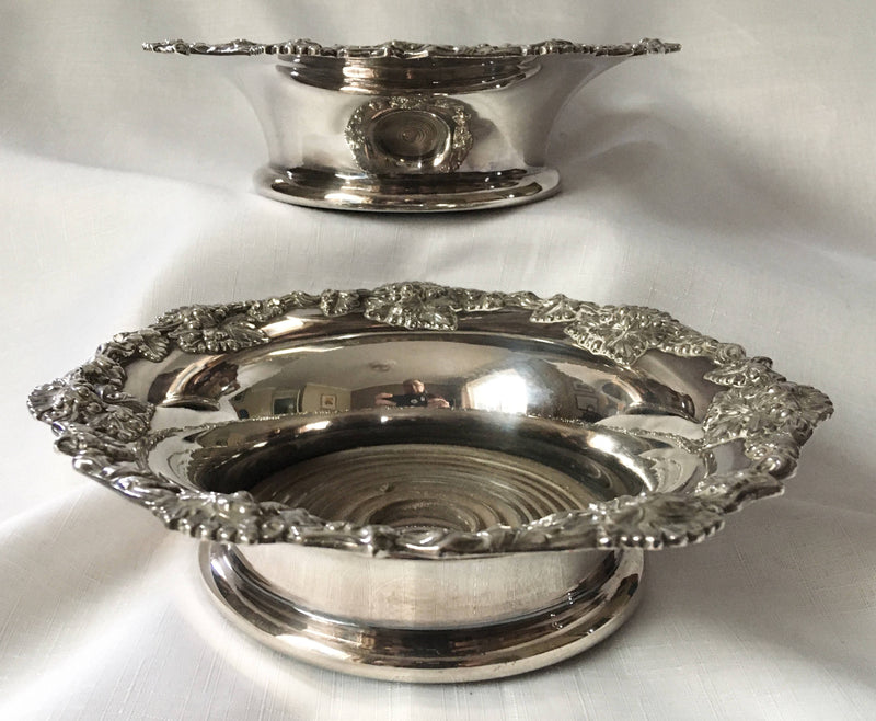 Victorian pair of silver plated bottle coasters with applied rims of trailing vines.