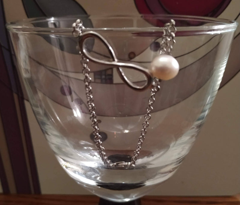 New sterling silver and pearl infinity bracelet