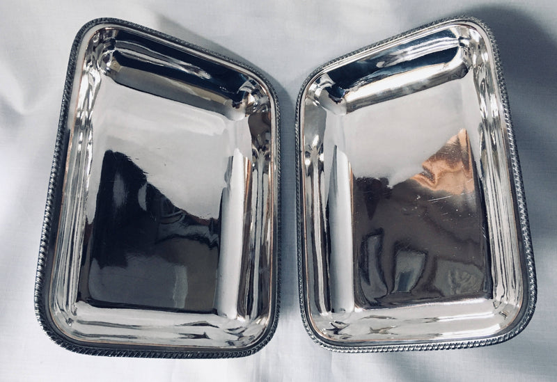 Late Georgian pair of crested, Sheffield Plated, entree dishes and covers, circa 1820 - 1830.