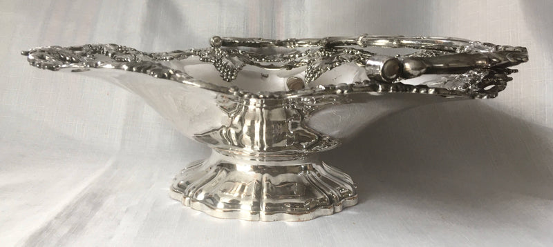 A striking late Georgian Old Sheffield Plate basket with applied fruiting vine decoration, circa 1830.