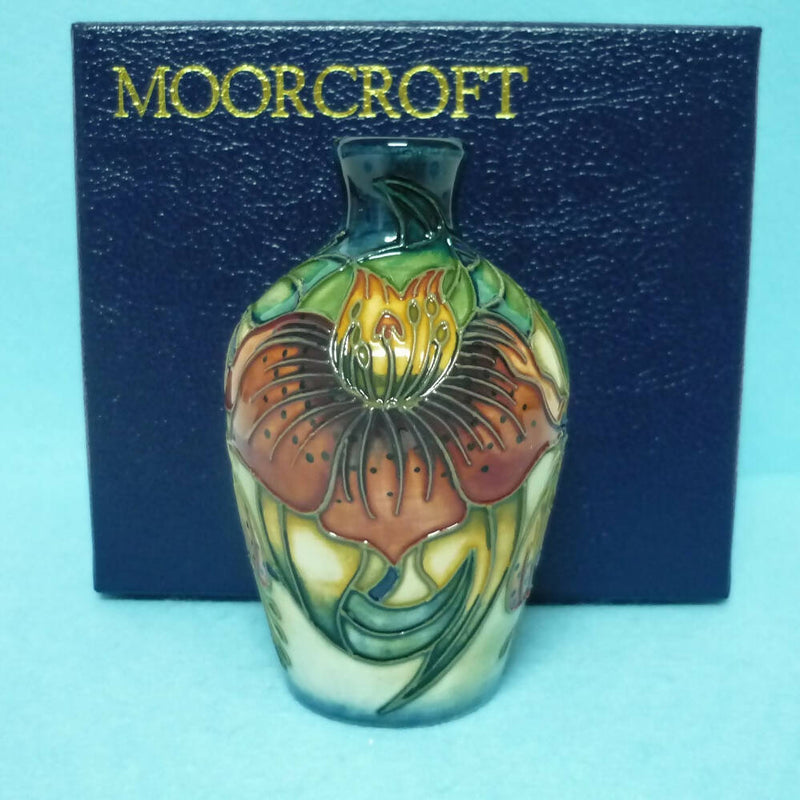 A Boxed Moorcroft Vase in the Anna Lily Design by Nicola Slaney.