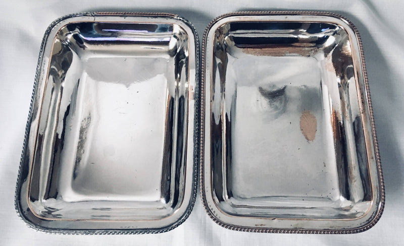 Late Georgian pair of crested, Sheffield Plated, entree dishes and covers, circa 1820 - 1830.